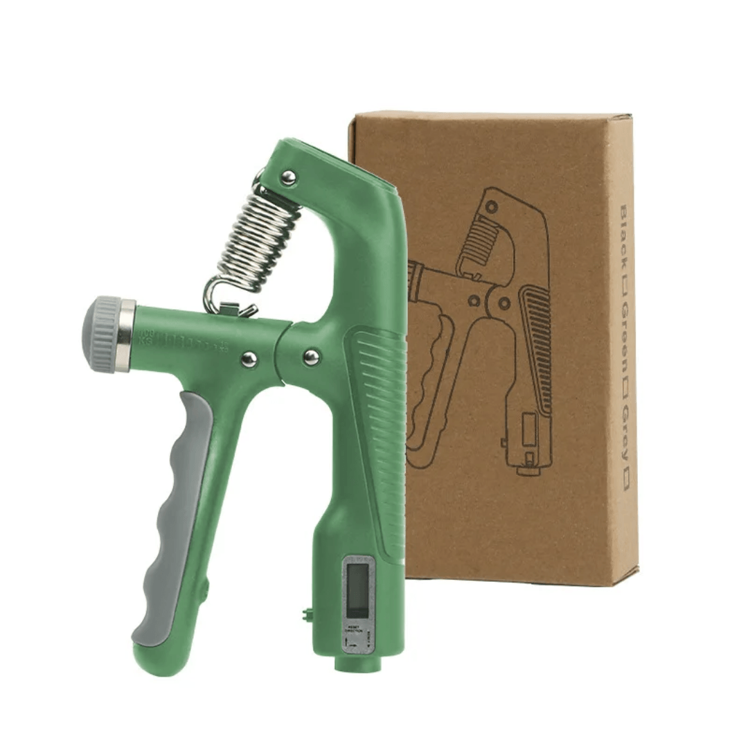 Green hand grip trainer with digital display next to a cardboard box on a white background