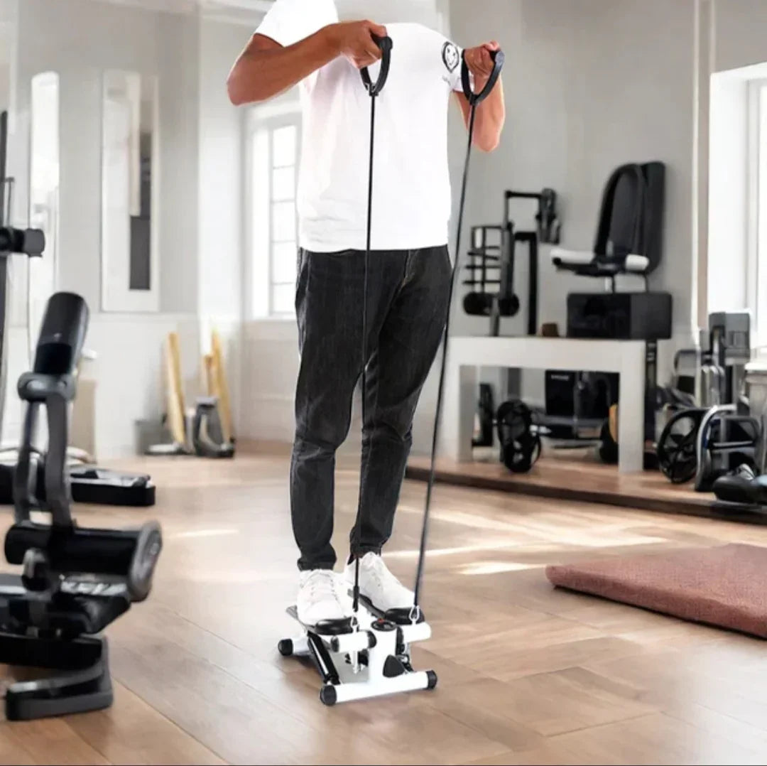 Person using a step machine in a gym setting